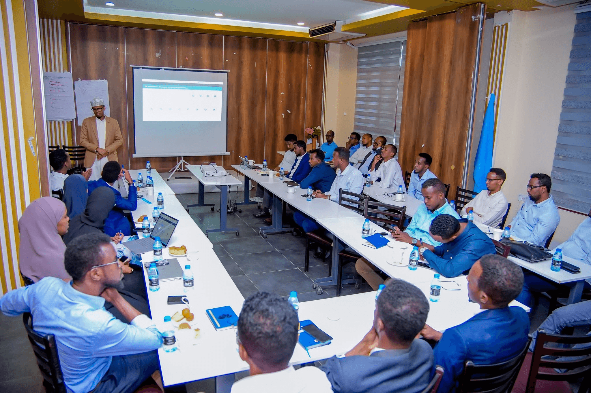 Dr. Ainab engaging with attendees at a corporate event